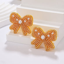Load image into Gallery viewer, Beaded Holiday Bow Earrings
