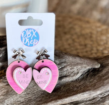 Load image into Gallery viewer, Hand-Painted Valentine&#39;s Day &quot;Be Mine&quot; Conversation Heart Earrings with Silver Bow Stud Toppers.
